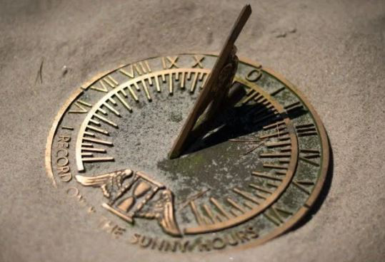Sundial casting a shadow used for telling time.