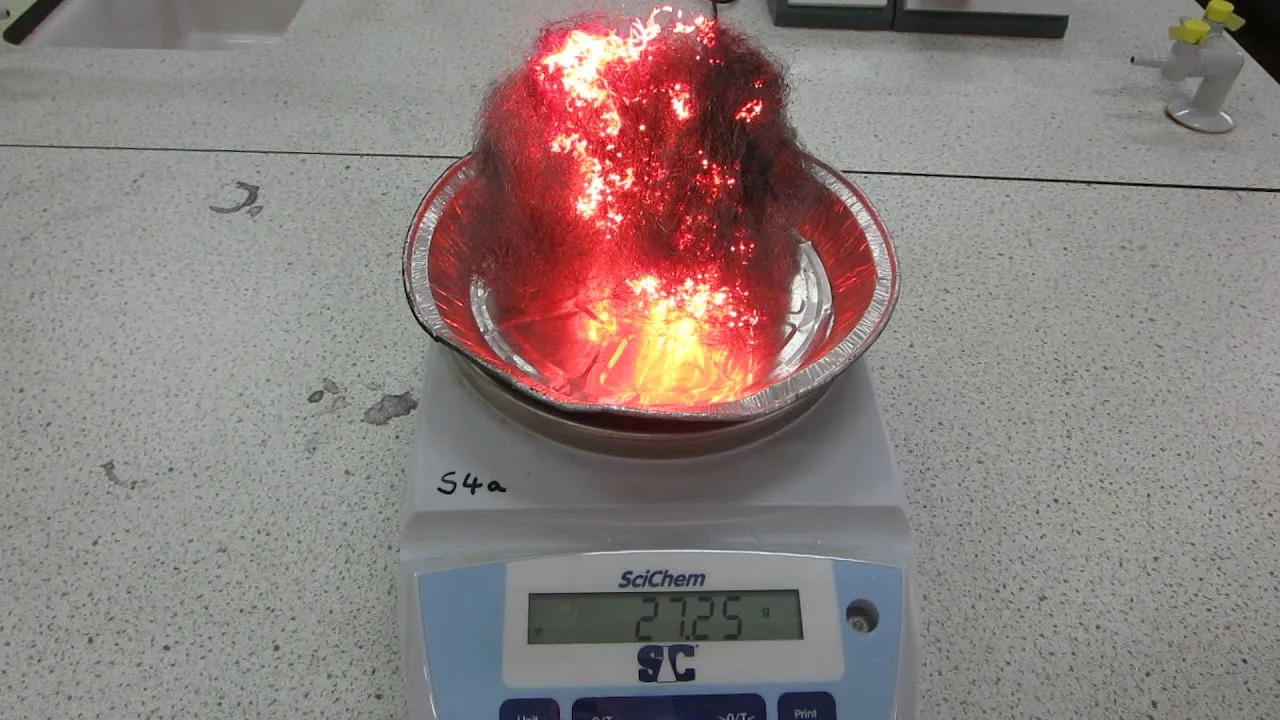 Burning steel wool on a balance