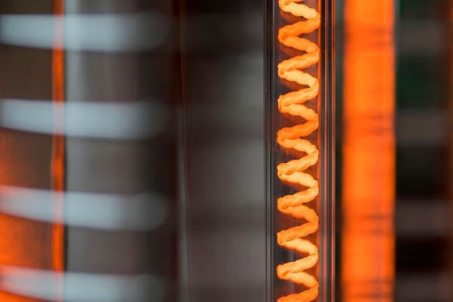 Close-up of a glowing heating coil wire.