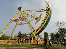 Pirate ship amusement park ride acting as a pendulum