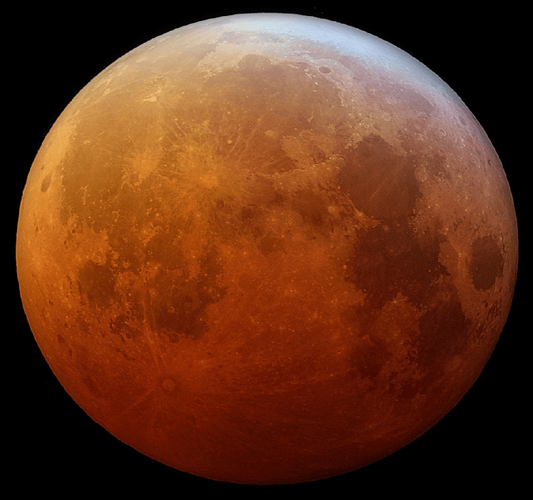 Photograph of the Moon during a total lunar eclipse, appearing reddish-orange.