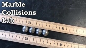 Marble collisions lab setup with marbles on measuring sticks